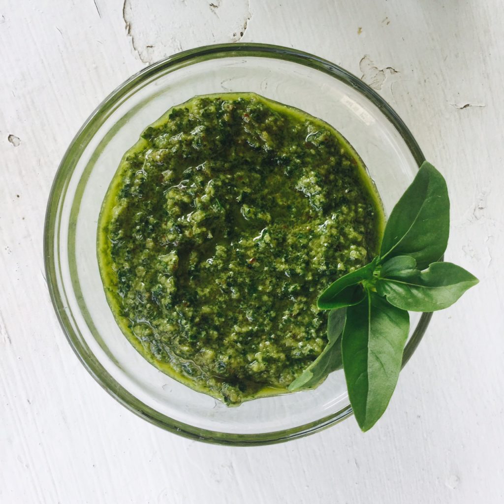 A super easy & healthy gluten free & vegan Lemon Basil Pesto. Great recipe for freezing your summer harvest!