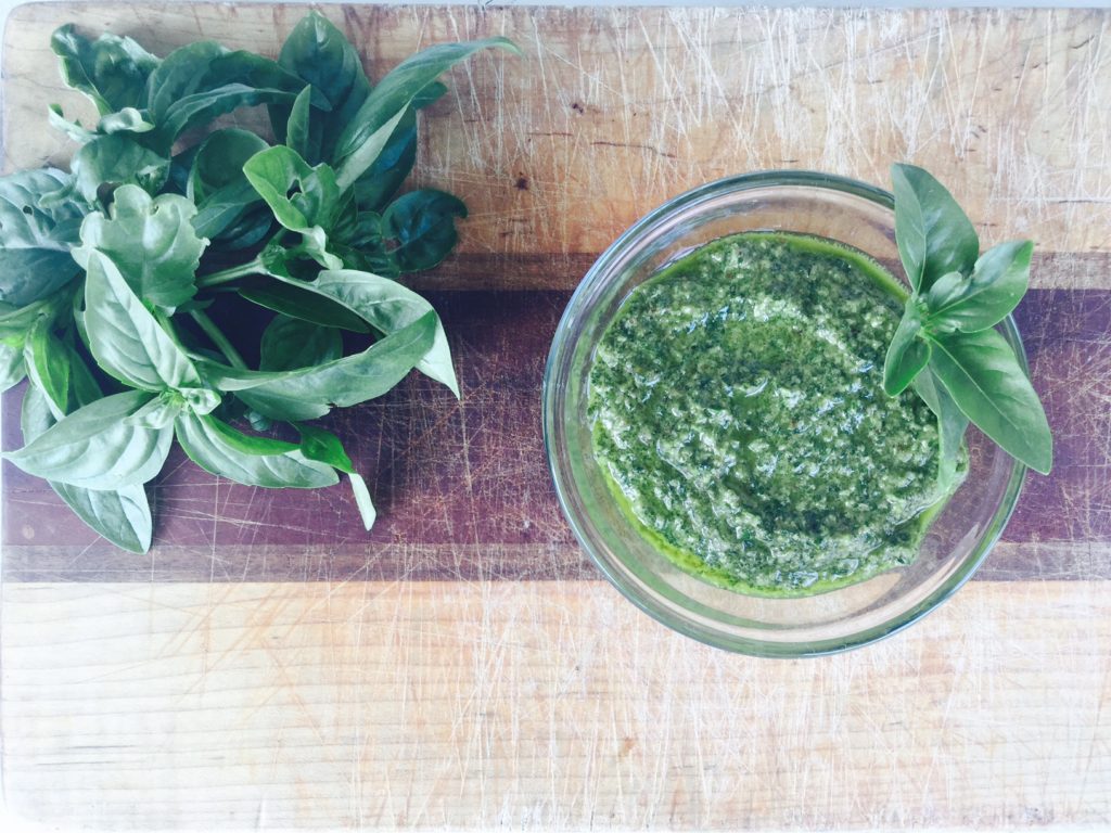 A super easy & healthy gluten free & vegan Lemon Basil Pesto. Great recipe for freezing your summer harvest!